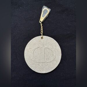 Christian Dior parfumes Beige Round Keychain with Gold Clip and mirror inside.